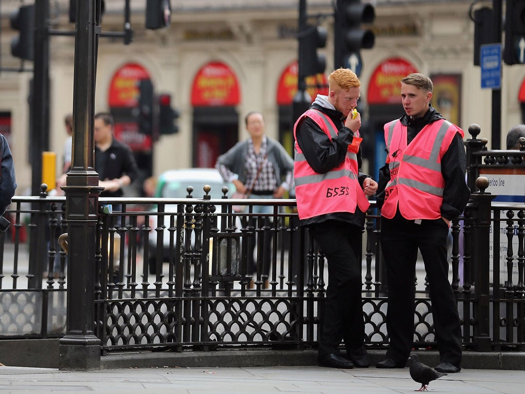 Pink-clad Olympic stewards have shown the world a friendly face