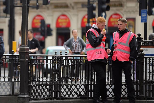 Pink-clad Olympic stewards have shown the world a friendly face