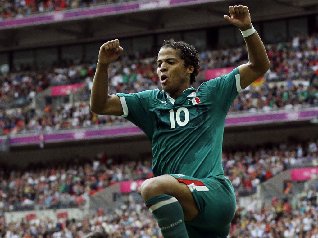 Mexican wave: Giovani Dos Santos celebrates his extra-time goal