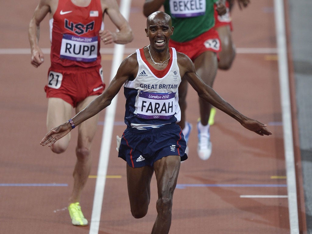Golden mo-ment: Farah crosses the line to win the 10,000 metres and the emotion begins to show