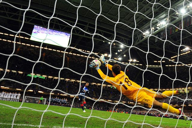Same old story: Daniel Sturridge's penalty is saved by substitute goalkeeper Lee Bumyoung