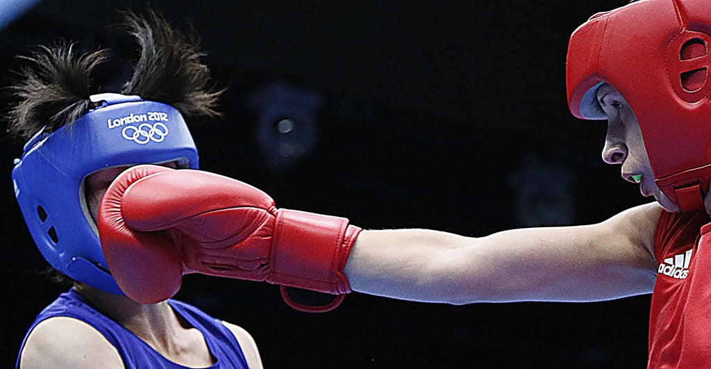 Russia's Elena Savelyeva won the first ever women's Olympic boxing bout