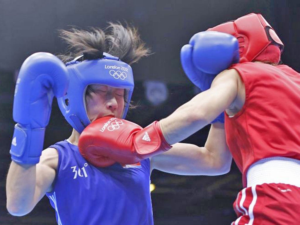 Elena Savelyeva and Kim Hye Song take part in the first-ever women's boxing match at the Olympics