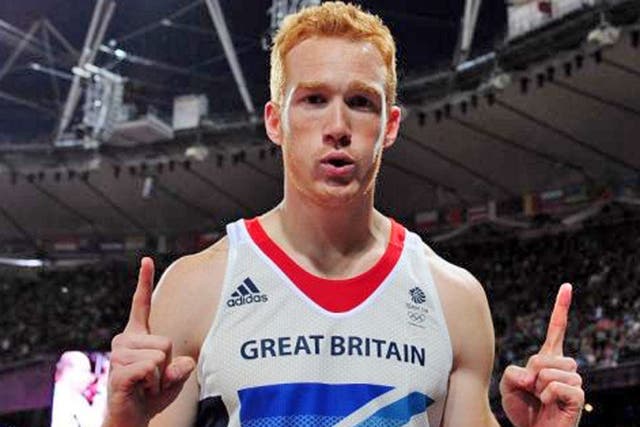 Greg Rutherford of Great Britain celebrates winning gold in the Men's Long Jump Final