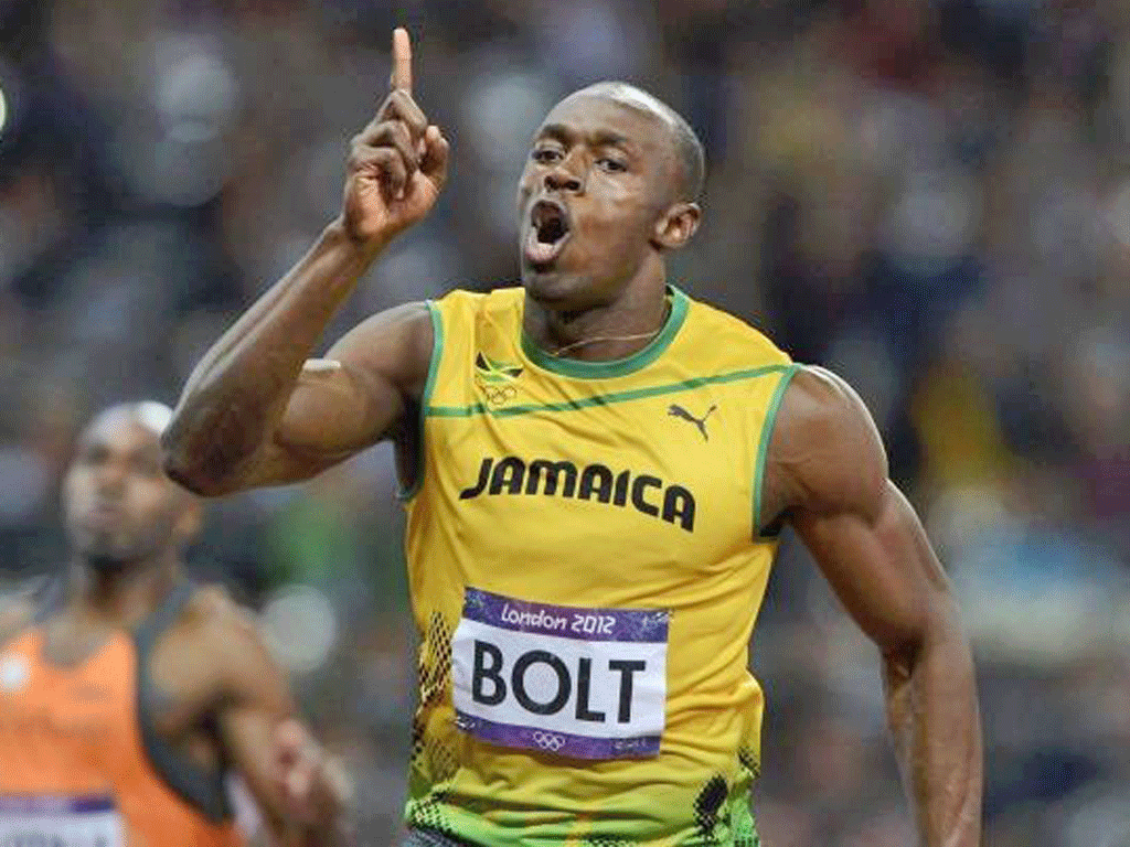 Usain Bolt celebrates his victory in the 100m final