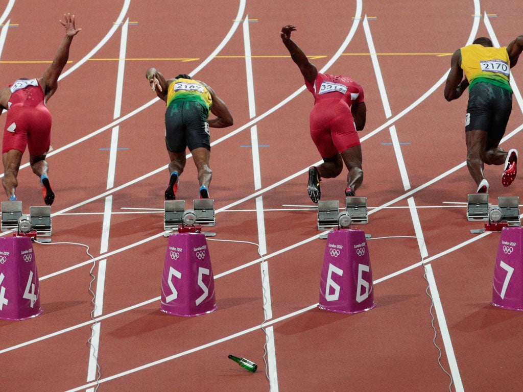 A bottle is thrown at the start of the men's 100m final