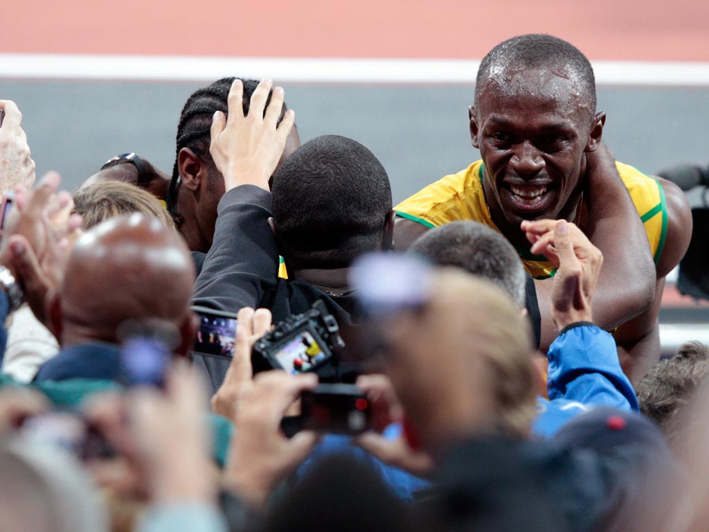 Usain Bolt celebrates his victory in the 100 metres