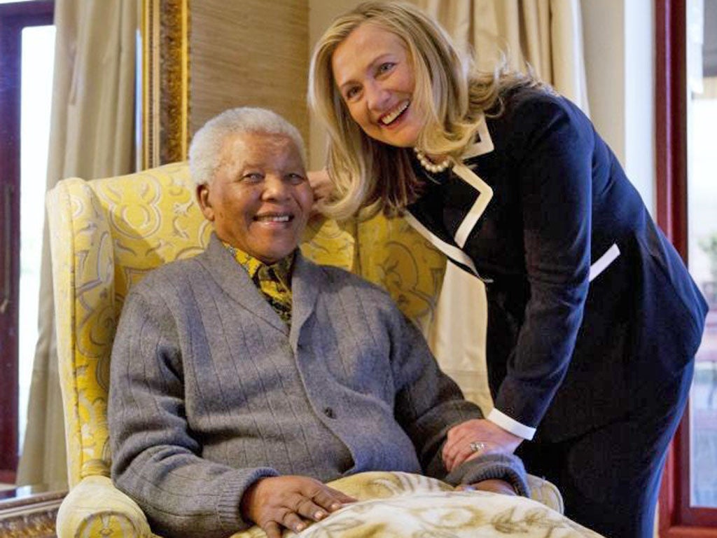 Hillary Clinton meets up with her friend and former South African president, Nelson Mandela, yesterday during her multi-nation tour through Africa
