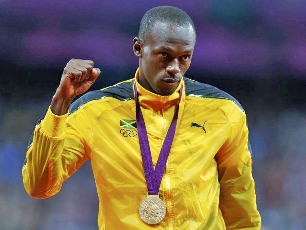 Usain Bolt gestures during last night’s gold medal presentation
ceremony