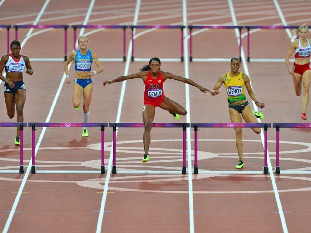 Perri Shakes-Drayton (left) struggles in the 400m hurdles semi-final last night