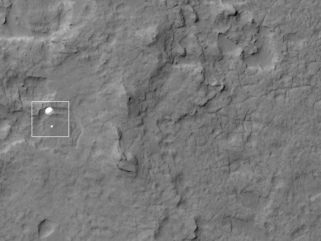 Nasa's Curiosity rover and its parachute spotted by Nasa's Mars Reconnaissance Orbiter as Curiosity descended to the surface