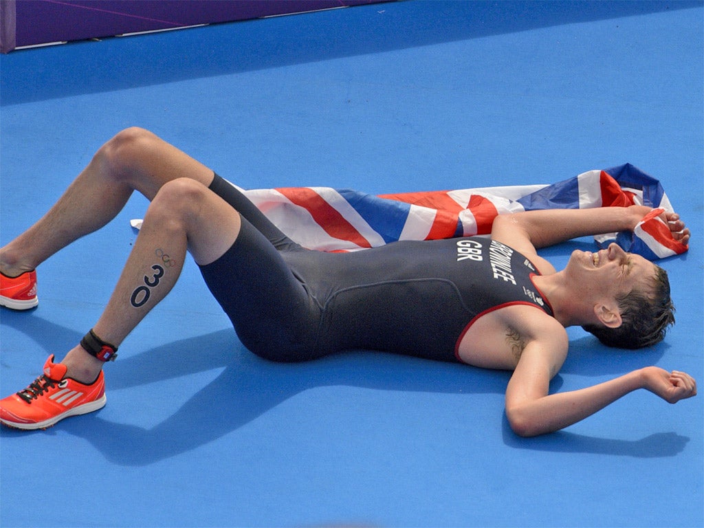 An exhausted Alistair Brownlee following his victory