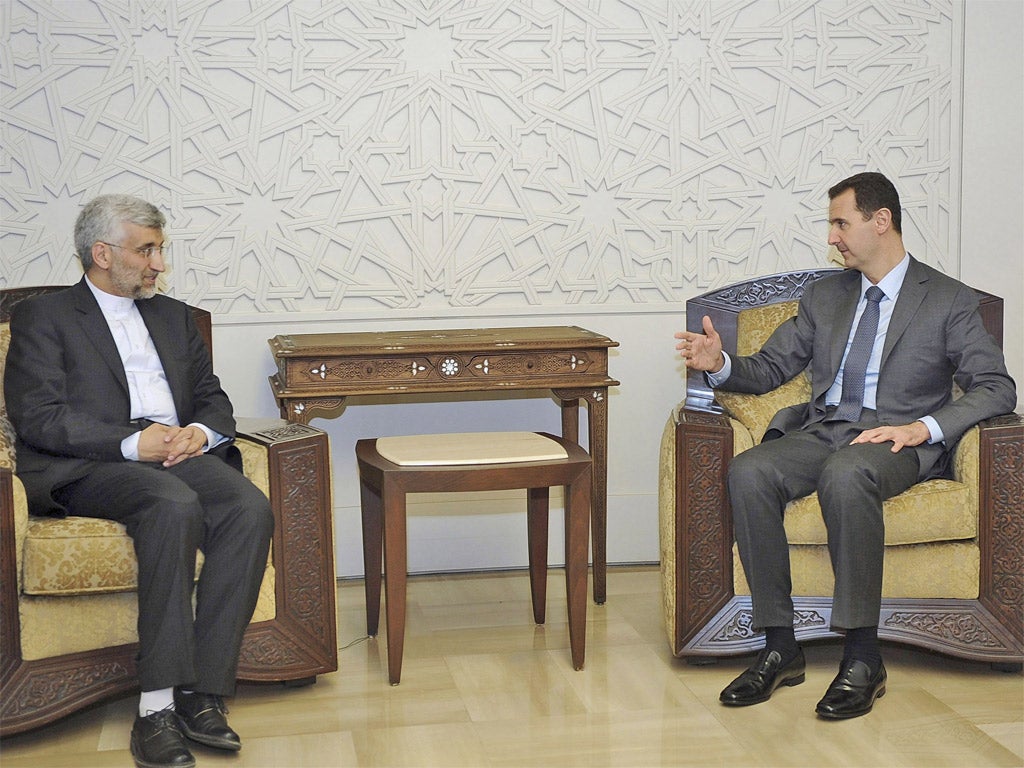 Syria's President Bashar al-Assad (right) meets Iran's Supreme National Security Council secretary Saeed Jalili, in Damascus yesterday