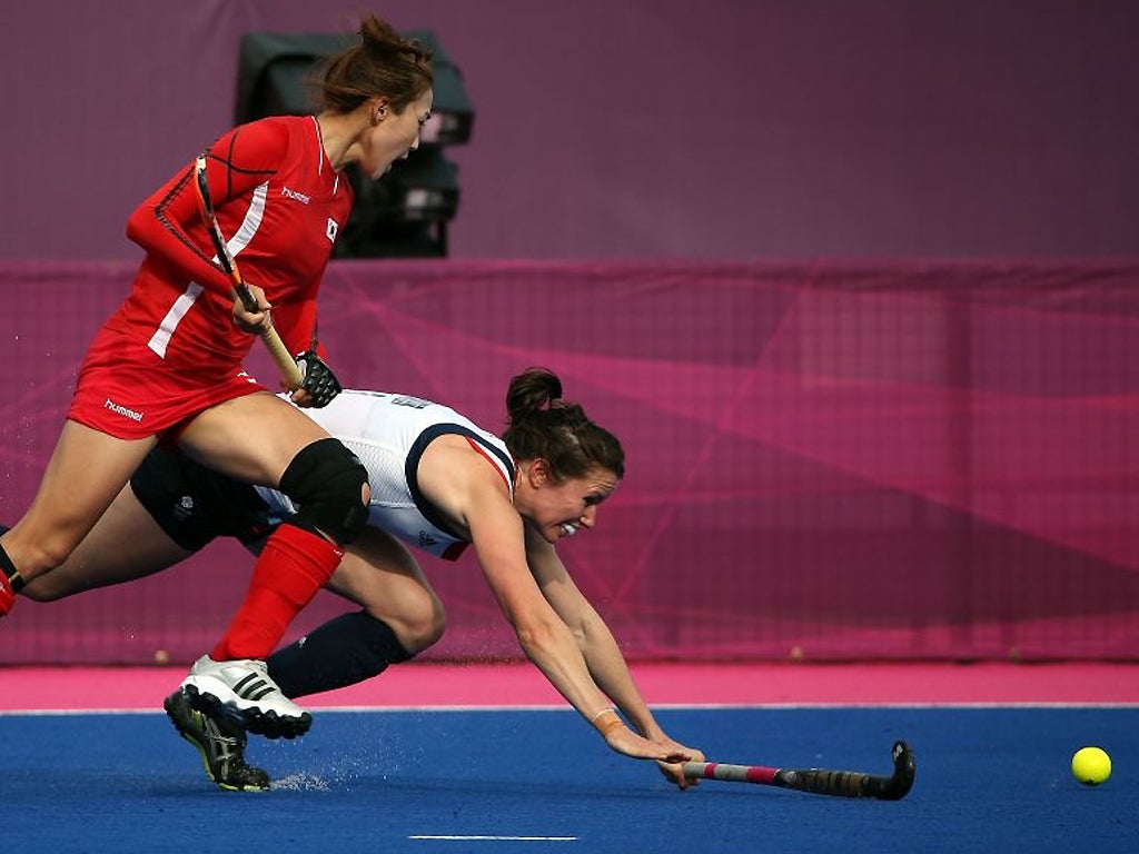 31 July: Anne Panter (back) of GB in action against Hye Lyoung Han of Korea
