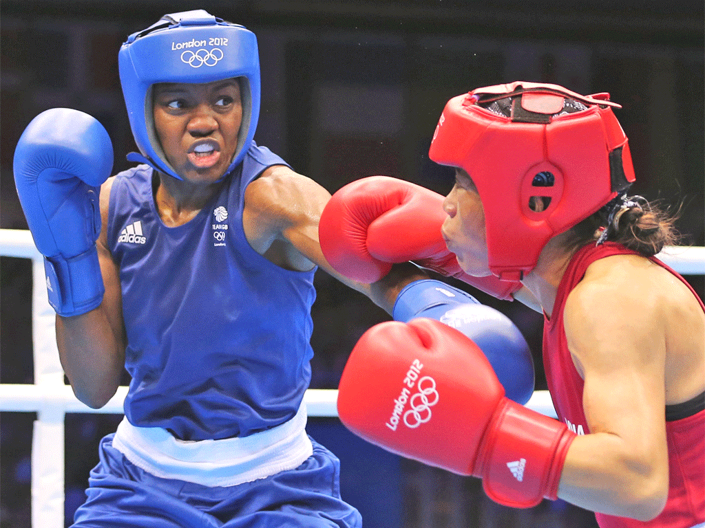 Nicola Adams (left) overpowers Mary Kom in their semi-final