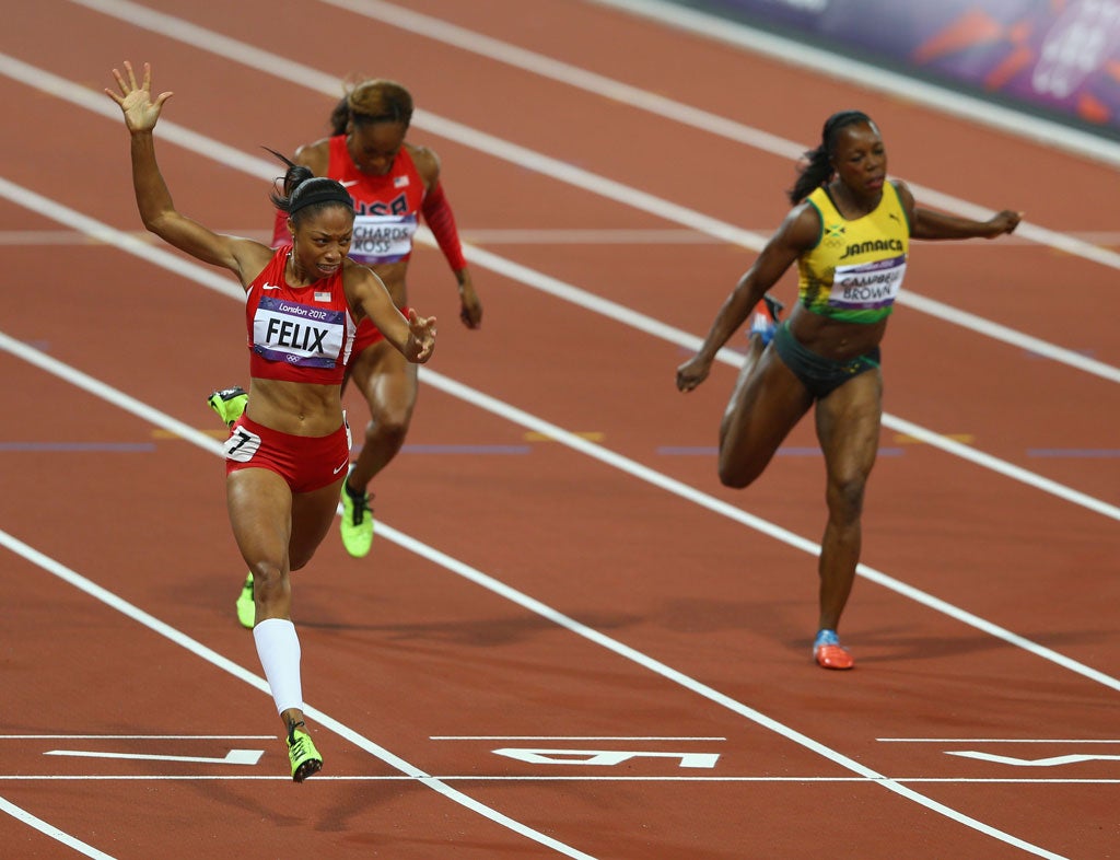 August 8, 2012: Allyson Felix of the United States crosses the finish line ahead of Shelly-Ann Fraser-Pryce of Jamaica and Sanya Richards-Ross of the United States to win the Women's 200m