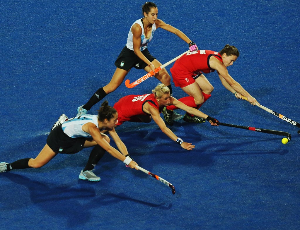 August 8, 2012: Alex Danson, Sarah Thomas of Great Britain and Silvina D'Elia and Josefina Sruoga of Argentina challenge for the ball during the Women's Hockey semi-final match between Argentina and Great Britain