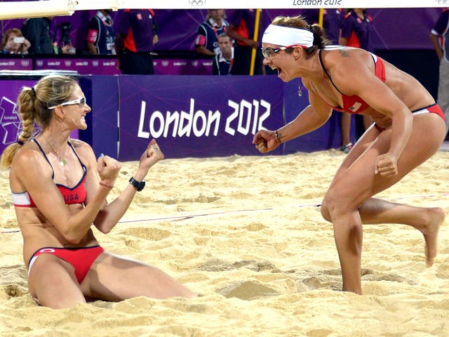Kerri Walsh Jennings (left) and Misty May-Treanor of the United States celebrate winning the gold medal last night