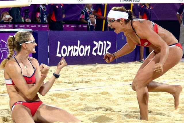 Kerri Walsh Jennings (left) and Misty May-Treanor of the United States celebrate winning the gold medal last night