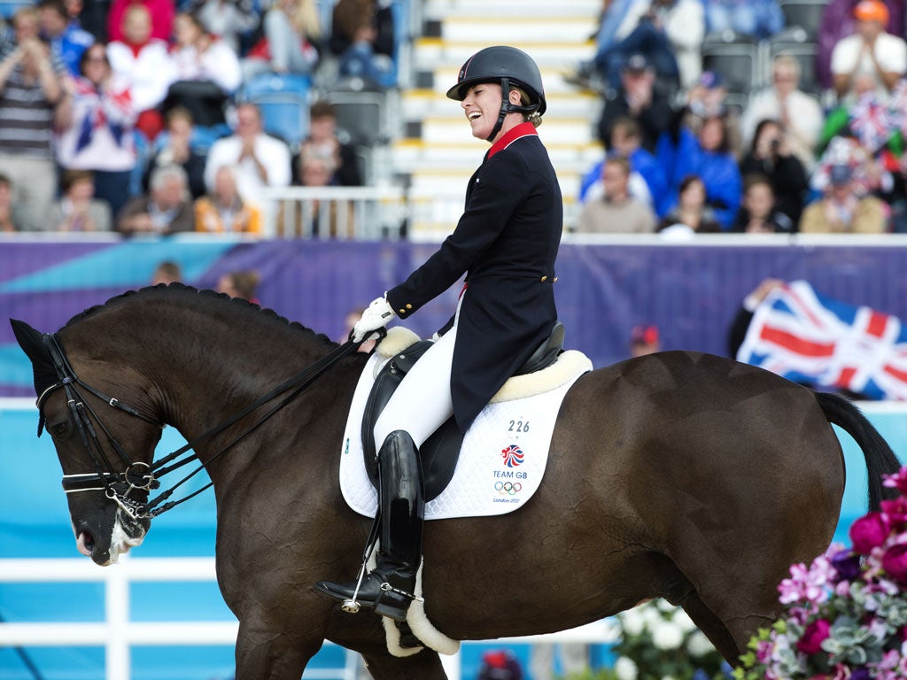 Charlotte Dujardin on Valegro celebrates after competing in the team Dressage