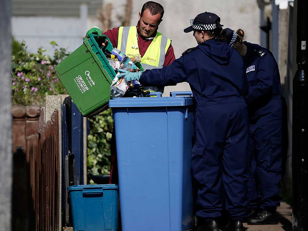 Police search refuse bins around the home of Tia Sharp's grandmother