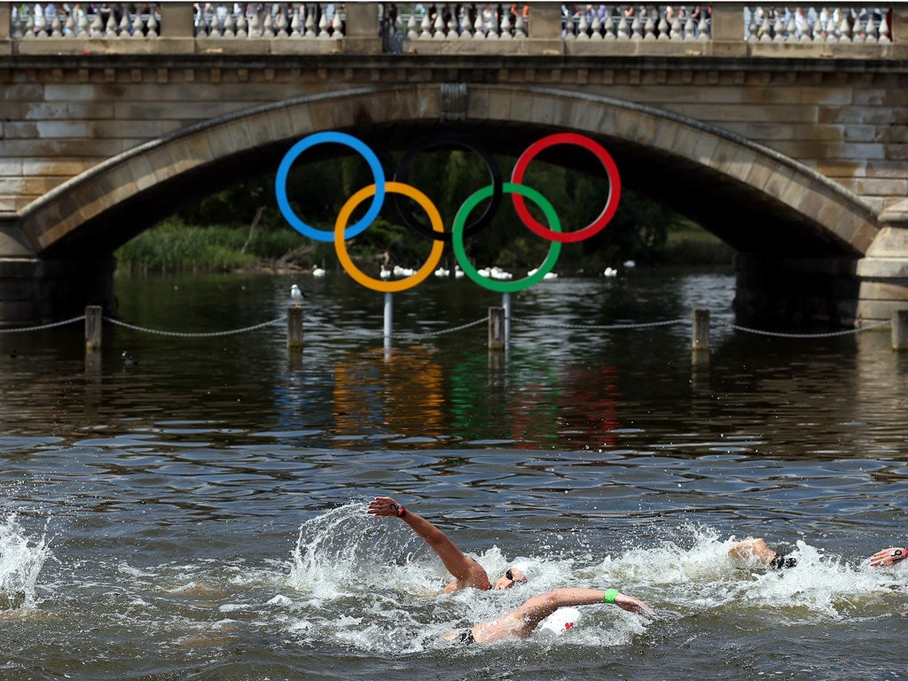 The Olympic rings in all their glory hanging below a bridge on the Serpentine during the women's open-water race