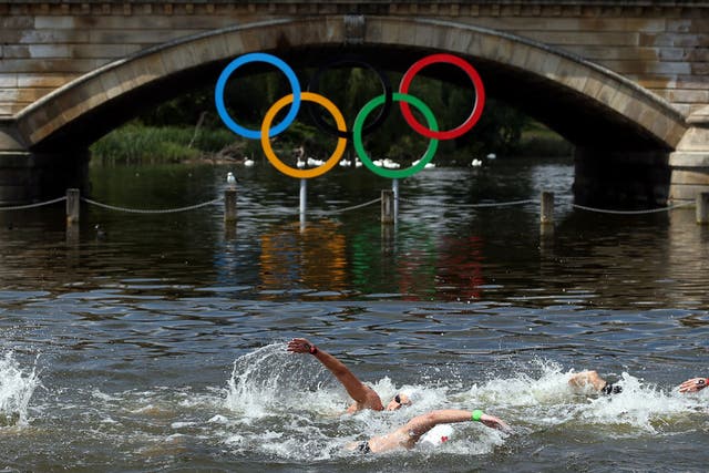 The Olympic rings in all their glory hanging below a bridge on the Serpentine during the women's open-water race