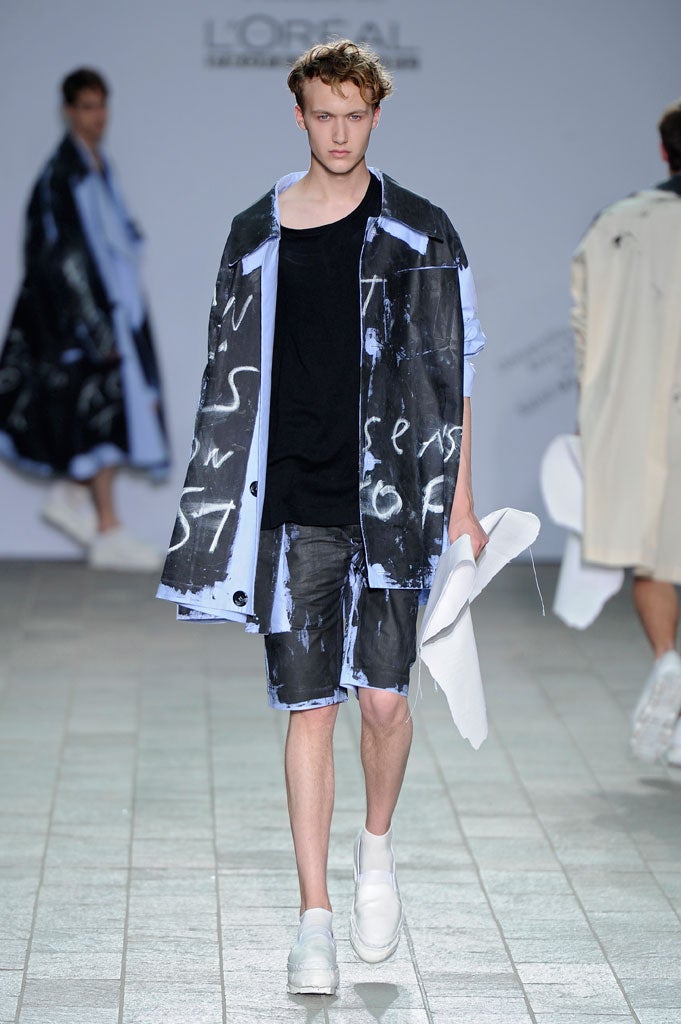 Tigran Avetisyan's graduate collection featured models stalking the catwalk wearing ripped and dishevelled toile and calico separates emblazoned with graffiti-ed slogans