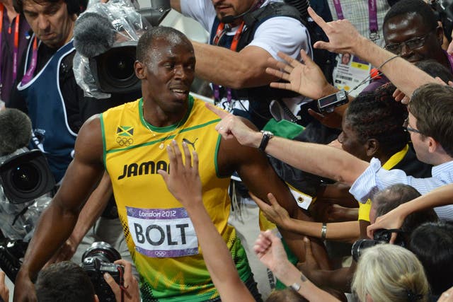 Usain Bolt is mobbed by fans