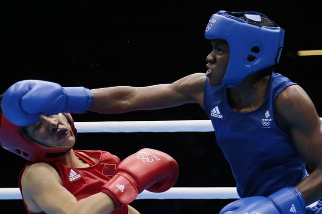 Nicola Adams sends Ren Cancan crashing to the canvas in the -51kg final yesterday