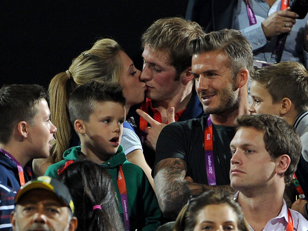 Trott and Kenny's first photographed snog, with Beckham in shot, had 'all the publicity impact of the perfect launch'