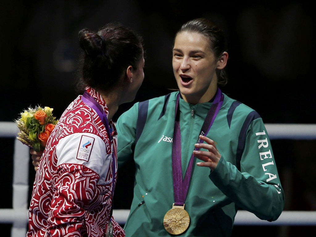 A jubilant Katie Taylor makes the most of the medal ceremony