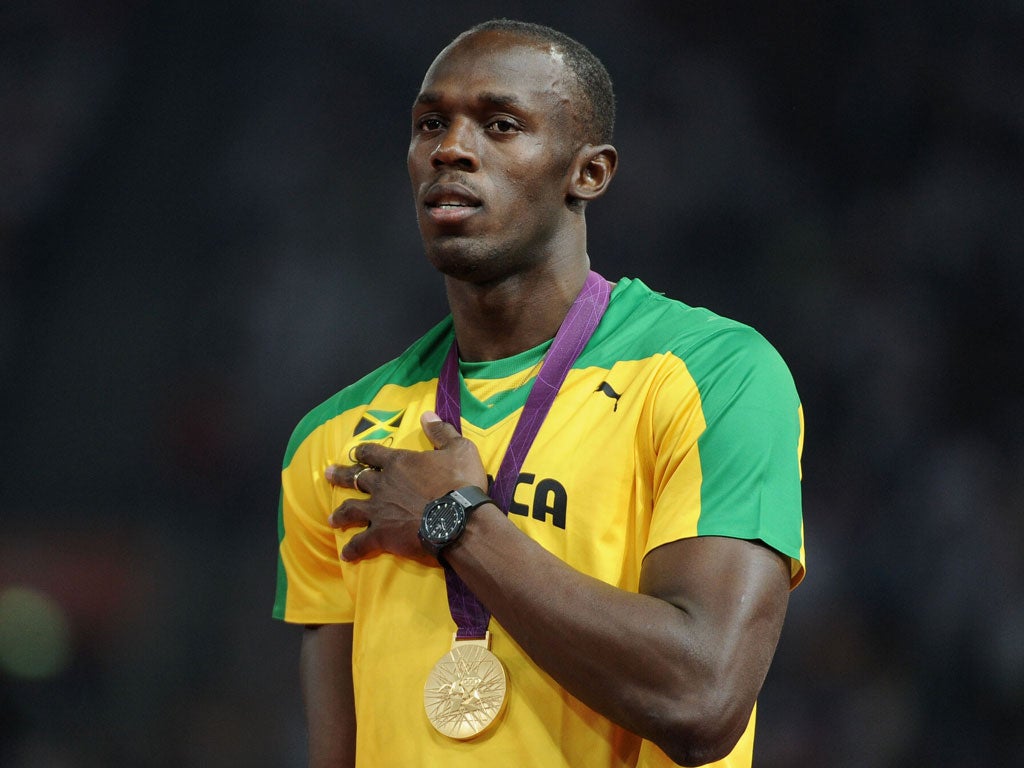 August 9, 2012: Gold medalist Usain Bolt on the podium