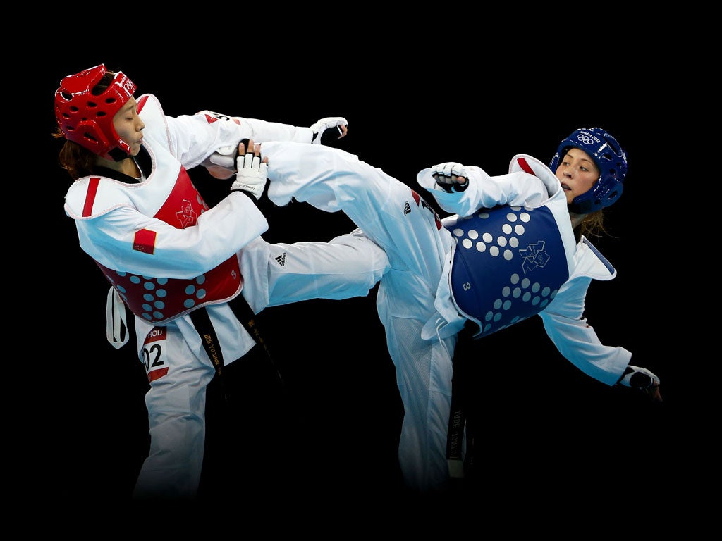 August 9, 2012: Jade Jones (in blue) won Britain's first ever taekwondo gold when she beat Yuzhuo Hou of China in the women's under-57kgs final at ExCeL