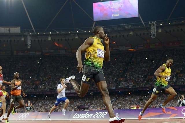 Usain Bolt silences his Jamaican rival Yohan Blake as he becomes the first man to retain the Olympic 200m title