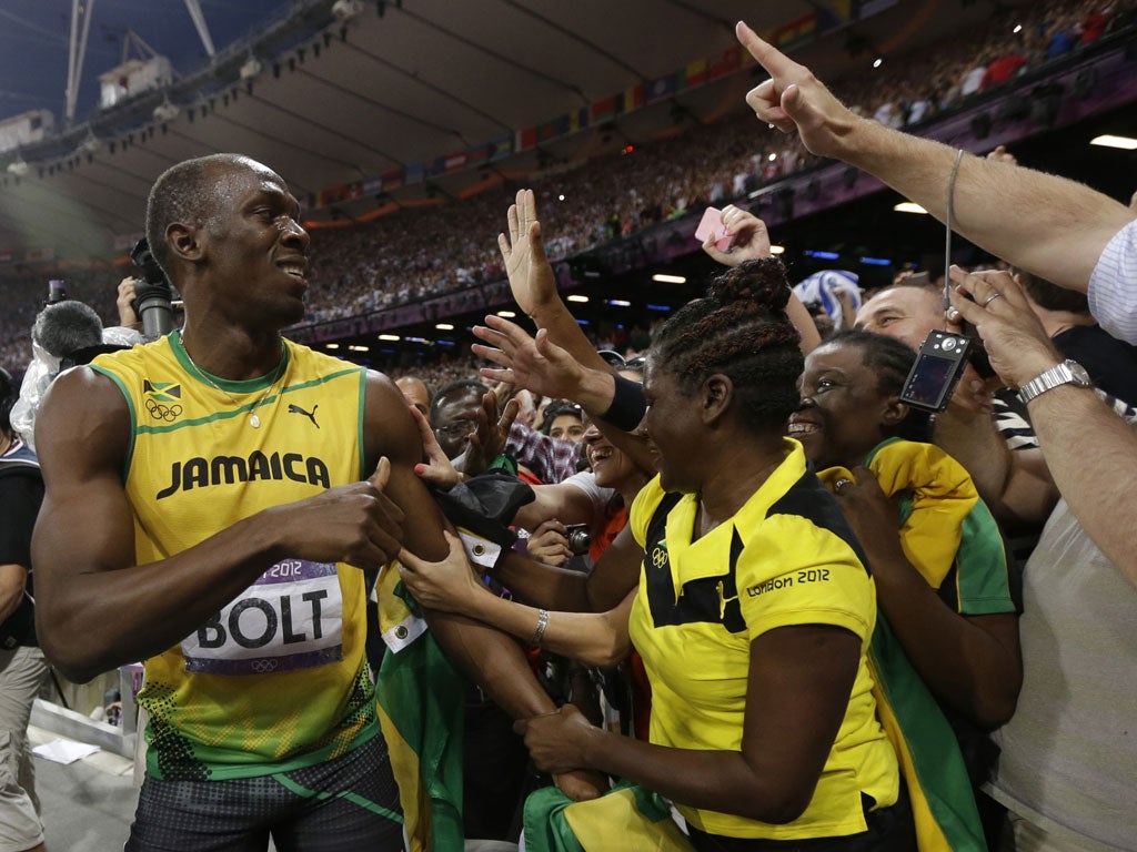 Usain Bolt celebrates winning 200m gold with his adoring fans