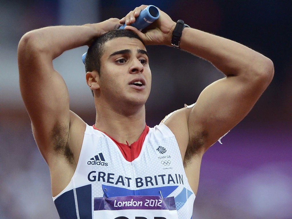 Britain's Adam Gemili reacts after his team are disqualified in their 4x100m heat last night