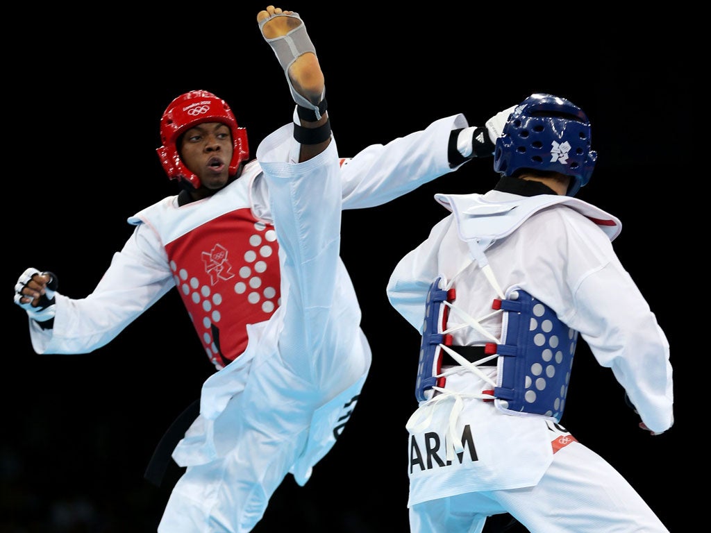 Lutalo Muhammad (left) of Great Britain takes the fight to Arman Yeremyan of Armenia