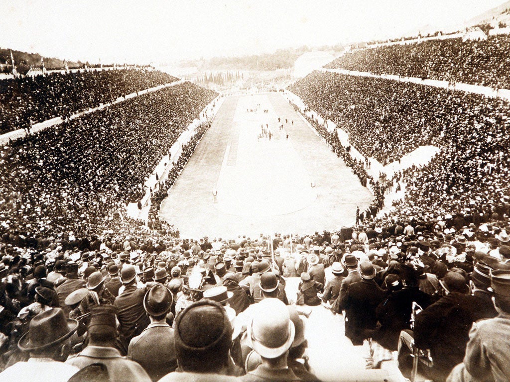 Long wait: The crowd packing the Olympic Stadium at Athens in 1896 eagerly anticipate a home marathon win