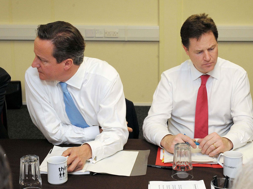 Divided rule: Grassroots want Nick Clegg, right, to take a much harder line with David Cameron