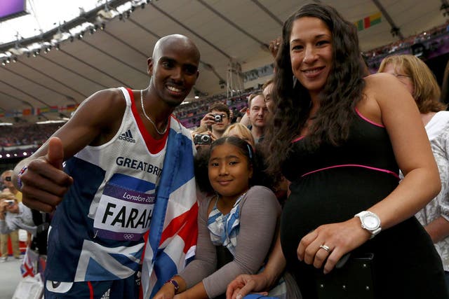 Family affair: Mo Farah celebrates his second gold medal with his stepdaughter Rihanna and wife Tanya at the Olympic Stadium