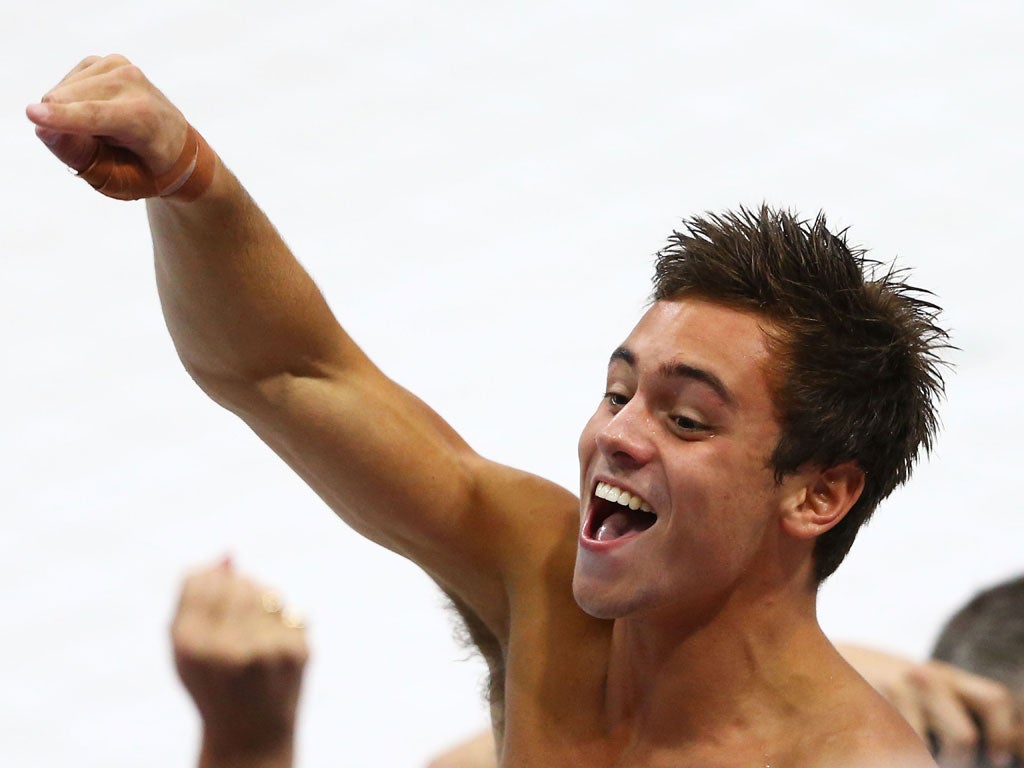 Tom Daley celebrates his bronze for the men's 10m diving on day 15 of the Olympics