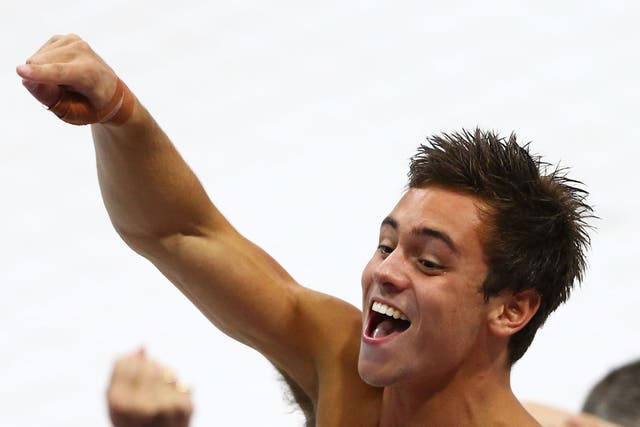 Tom Daley celebrates his bronze for the men's 10m diving on day 15 of the Olympics