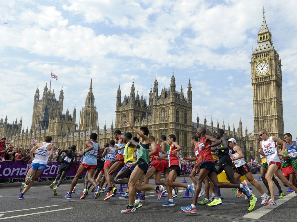 August 12, 2012: Athletes run in front of Big Ben and the Palace of Westminster during the men's marathon