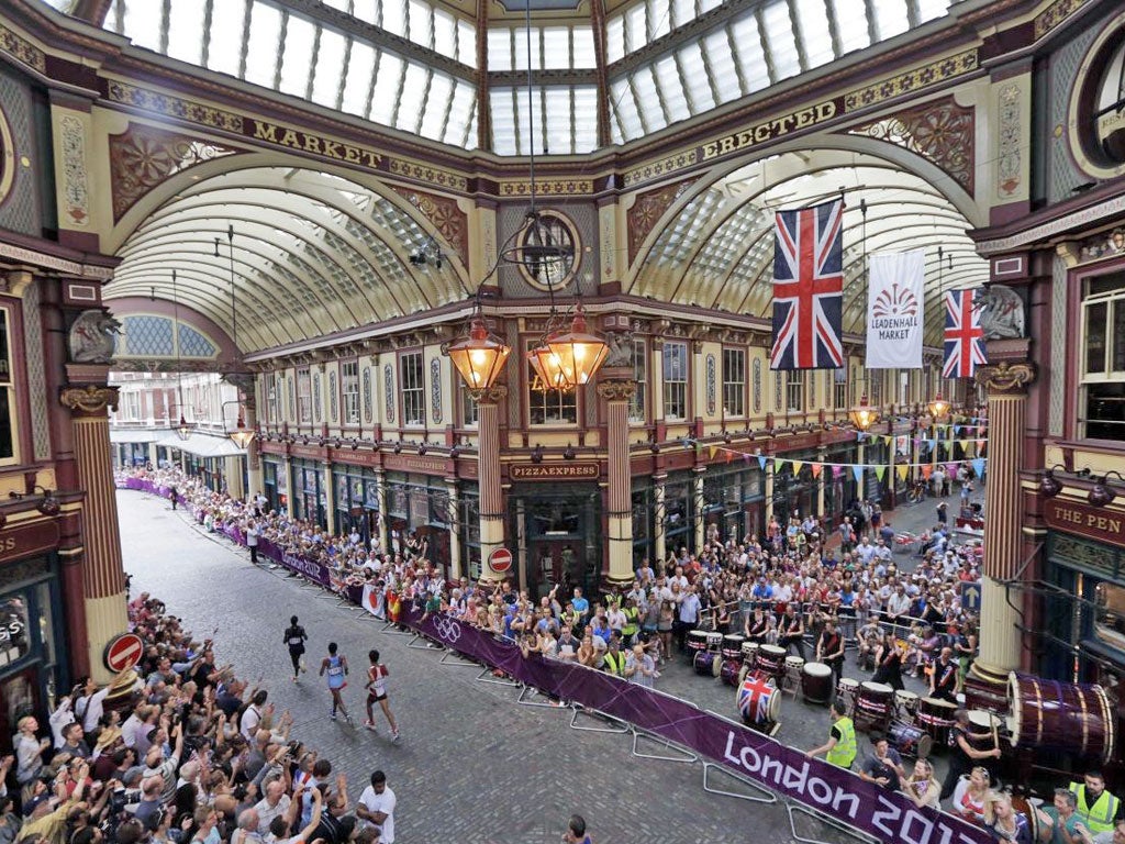 Streets paved with gold Runners pass through the historic Leadenhall Market in the City of London during the marathon yesterday. Stephen Kiprotich won the race to give Uganda their first medal