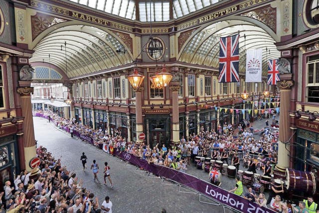 Streets paved with gold Runners pass through the historic Leadenhall Market in the City of London during the marathon yesterday. Stephen Kiprotich won the race to give Uganda their first medal