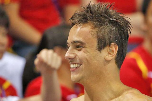 Tom Daley: In need of a sugar rush on Saturday, he ate some pick
and mix from a volunteer