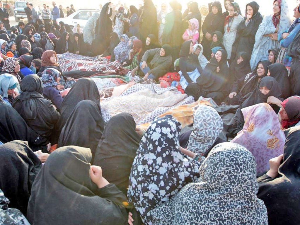 Villagers from Bajeh Baj mourning the quake victims