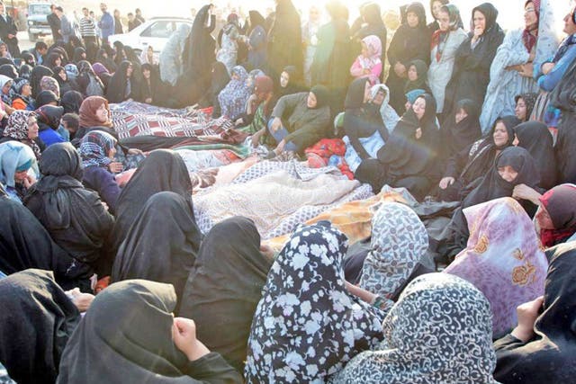 Villagers from Bajeh Baj mourning the quake victims