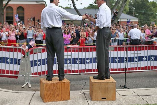 Boxing clever: Paul Ryan, left, and Mitt Romney at a rally in Ashland, Virginia, yesterday. They promise to rebuild America